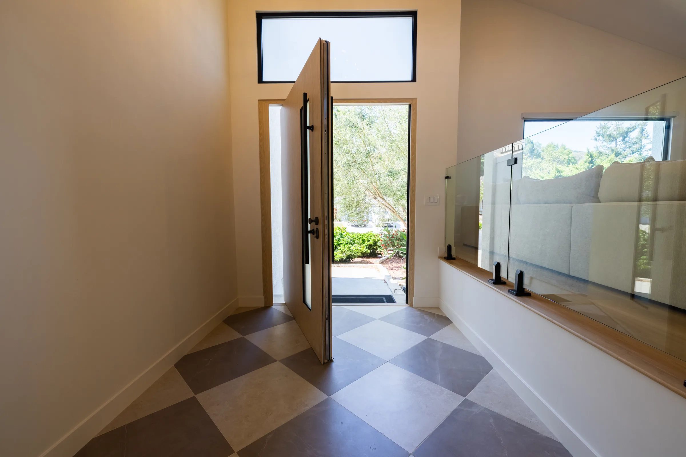 Bronze pivot front door installation